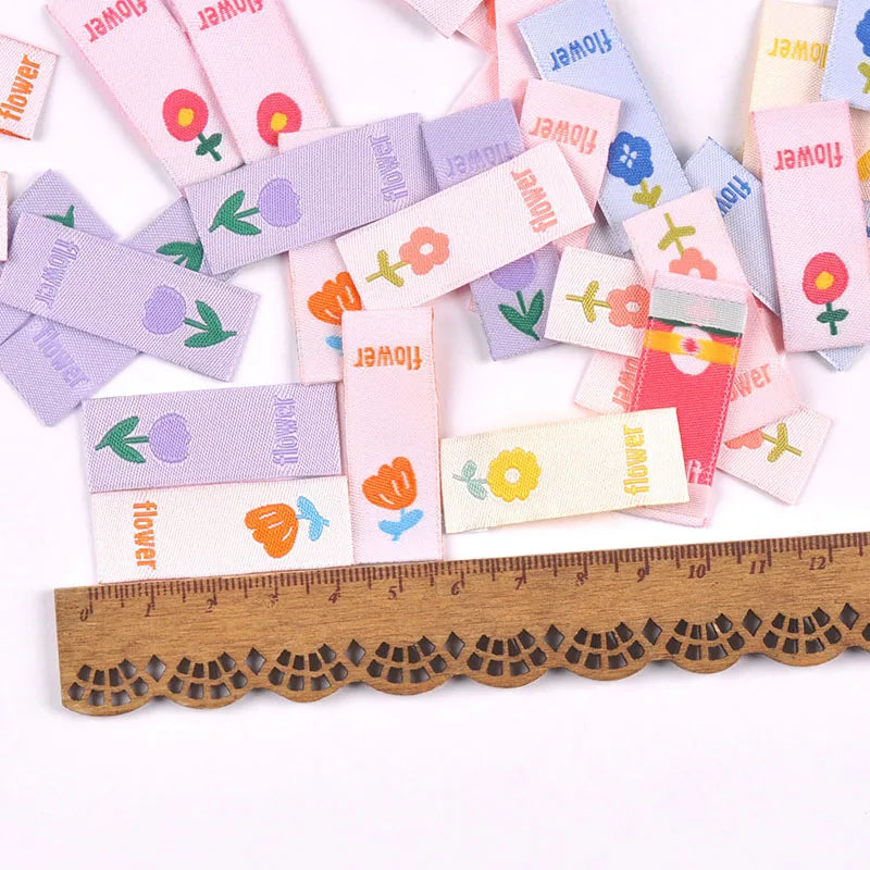 50pcs Cute Flower Embroidery Labels DIY Garment Accessories Handmade Clothing Bag Shoes Tags Kids Sewing Crafts 41x15mm c3630 Qme random mixed