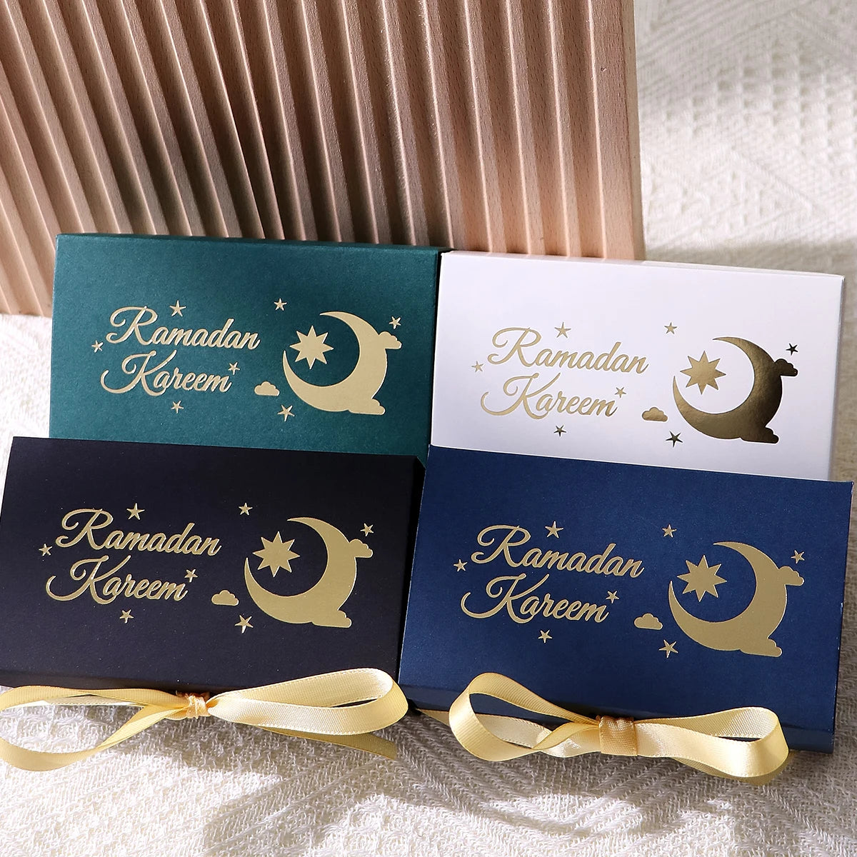10 Rectangular Multi-Colored Gift Boxes with Gold Crescent and Planet Designs Printed on Them, Specifically Designed for Ramadan, and Adorned with Gold Ribbons — Perfect for Packaging Homemade Sweets, Premium Dates, and Sma Qme
