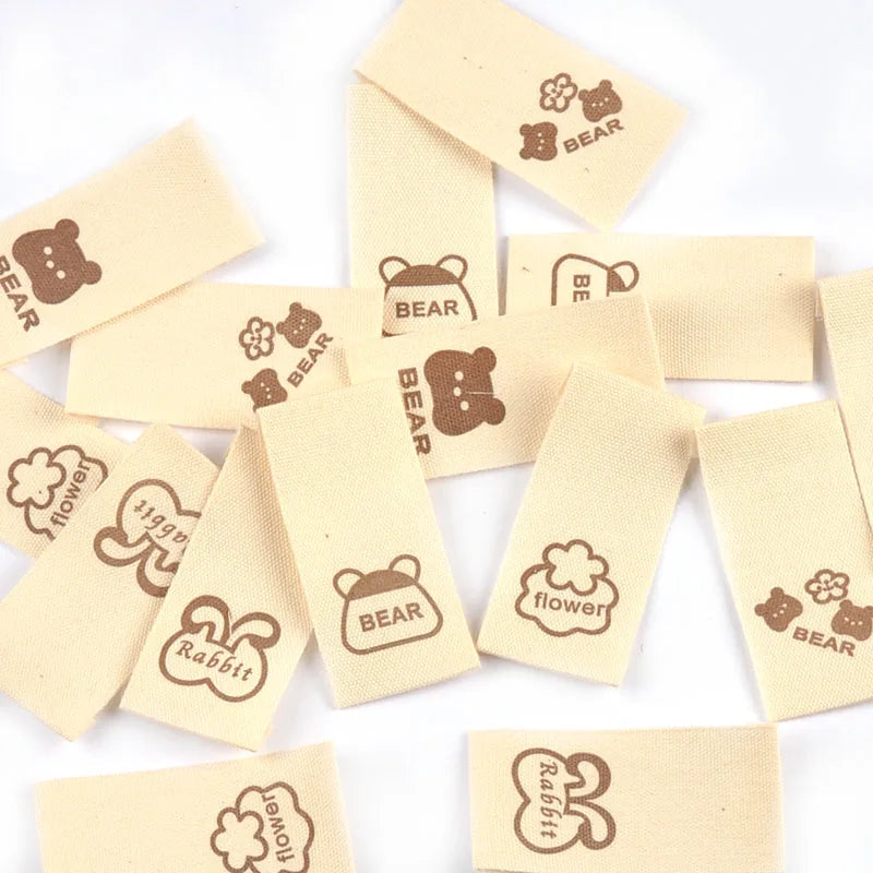 50pcs/lot 20x40mm Lovely Bear/Flower/Rabbit Printed Beige Label For DIY Decor Clothing Sewing Accessories Handmade Crafts c4146 Qme