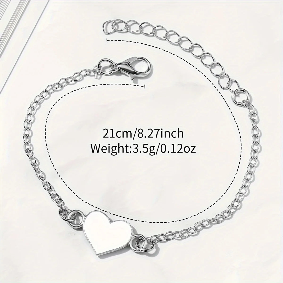 Silver hollowed out large dial, white belt, ladies' quartz watch, heart-shaped fine bracelet, two-piece set Qme