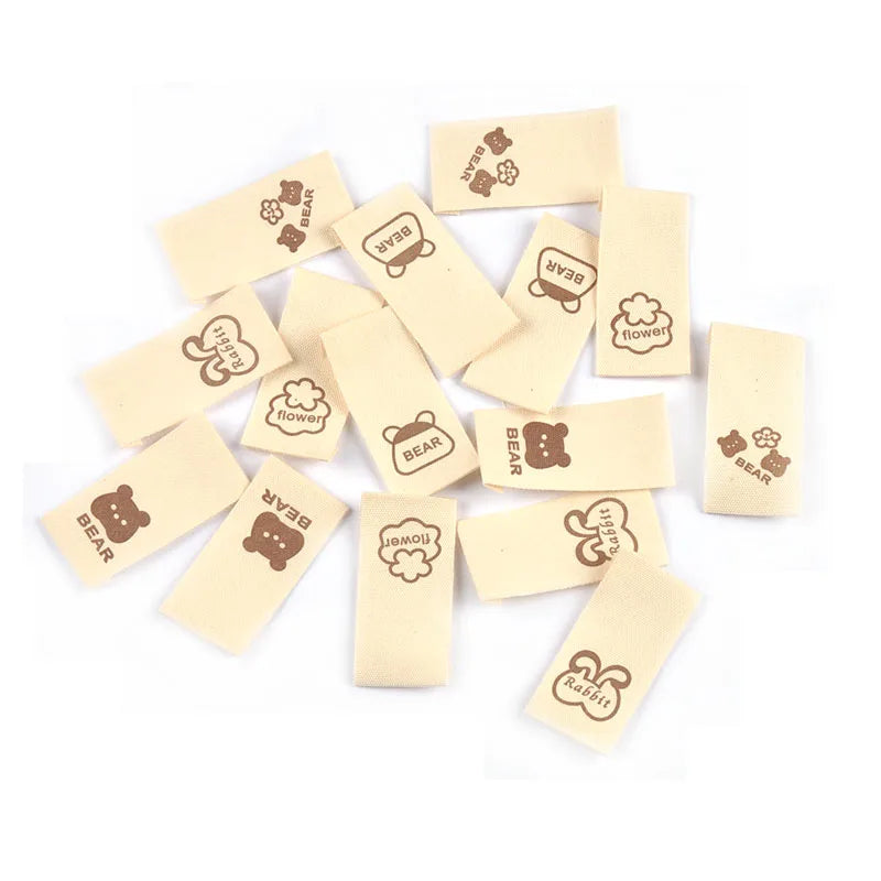 50pcs/lot 20x40mm Lovely Bear/Flower/Rabbit Printed Beige Label For DIY Decor Clothing Sewing Accessories Handmade Crafts c4146 Qme