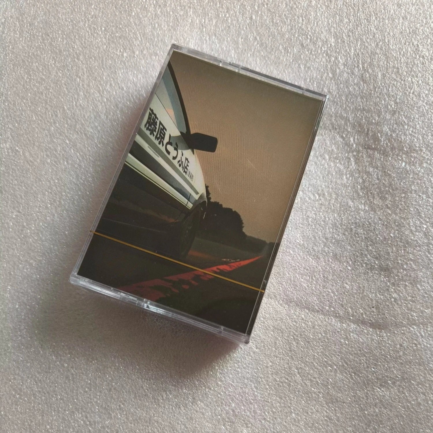 Classic Racing Anime Soundtrack Cassette Tape, Retro Nostalgic Format, High-Energy Theme Song Reissue, Ideal for Collectors Qme