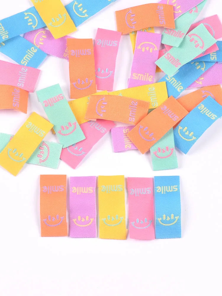50Pcs Colorful Smile Embroidery Colth Labels Garment Washable Care Tags Sewing Accessories Crafts DIY Knitting Bag Shoe Supplies Qme