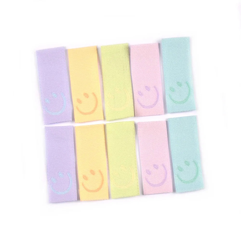 50Pcs New Candy Color Embroidery Smile Labels For Sewing Accessories Clothes Washable Care Garment Bags Tags DIY Supplies c3513 Qme