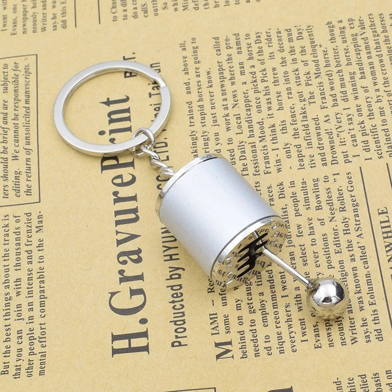 A Mini Gear Shift Keychain Modeled After Car Parts, Featuring a Cool Design for Automotive Enthusiasts to Carry Daily Qme