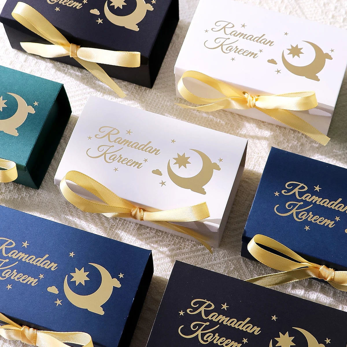 10 Rectangular Multi-Colored Gift Boxes with Gold Crescent and Planet Designs Printed on Them, Specifically Designed for Ramadan, and Adorned with Gold Ribbons — Perfect for Packaging Homemade Sweets, Premium Dates, and Sma Qme
