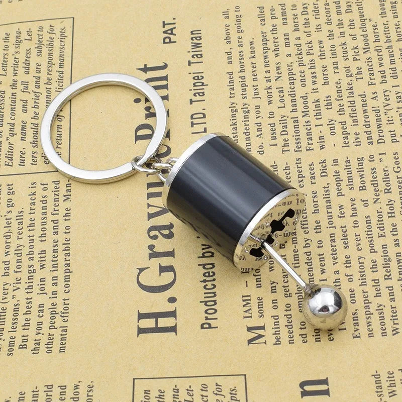 A Mini Gear Shift Keychain Modeled After Car Parts, Featuring a Cool Design for Automotive Enthusiasts to Carry Daily Qme Black 1pc