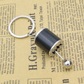 A Mini Gear Shift Keychain Modeled After Car Parts, Featuring a Cool Design for Automotive Enthusiasts to Carry Daily Qme Black 1pc
